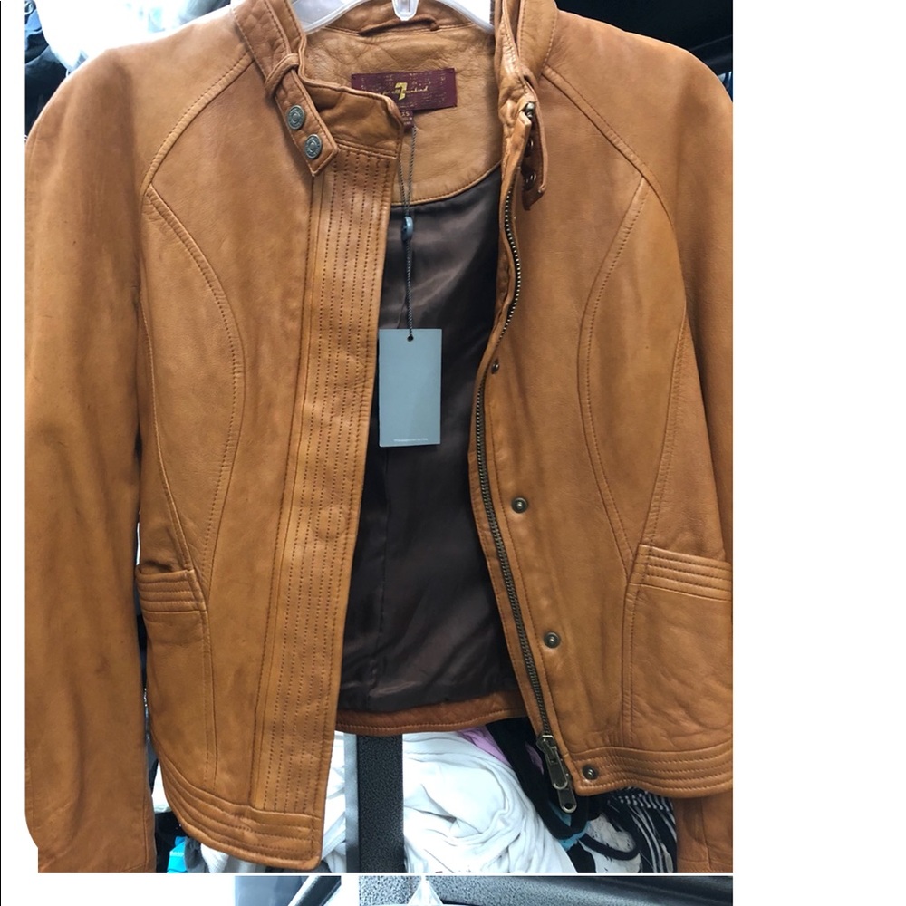 Brand new leather jackets with tags attached